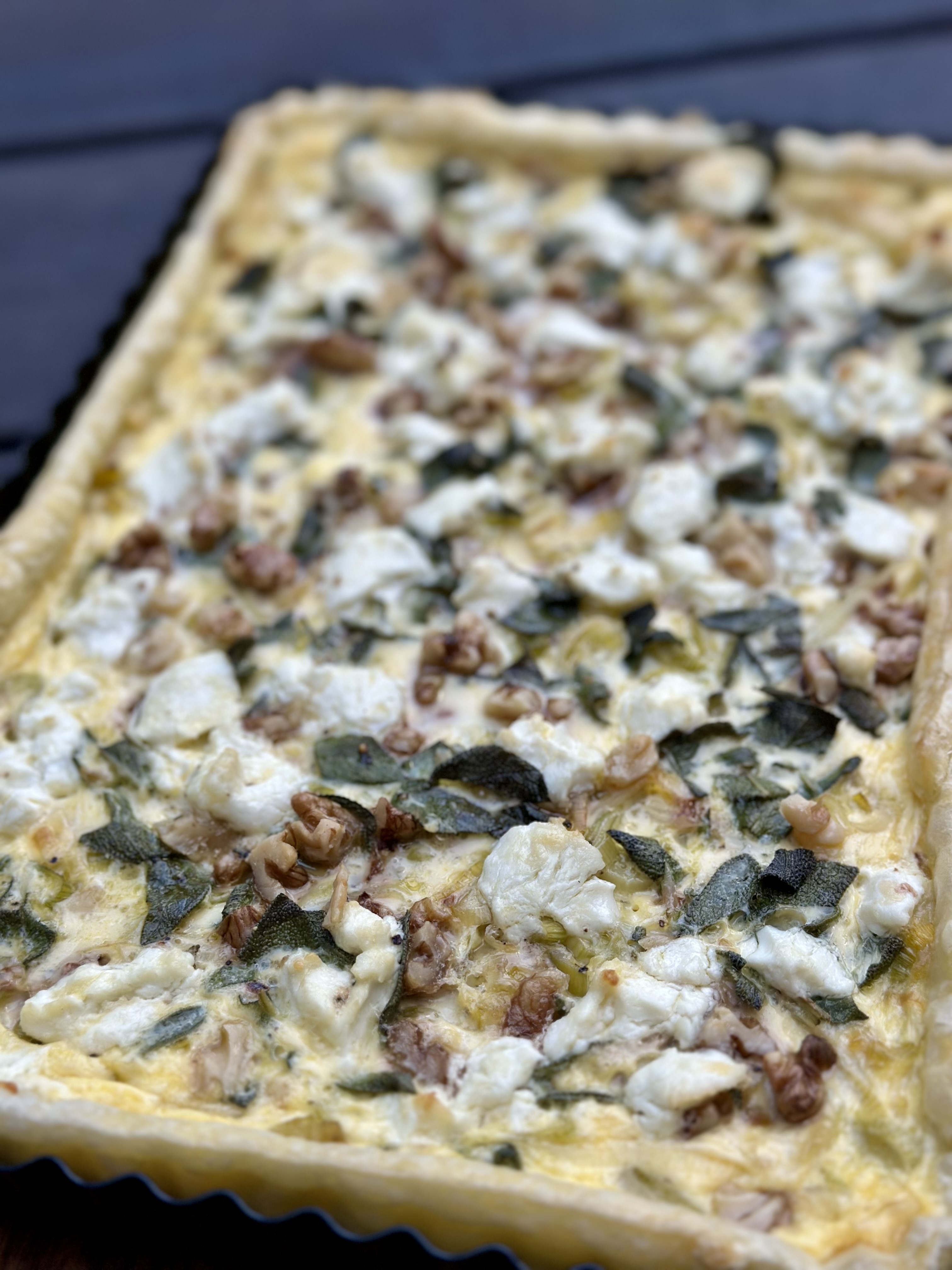 Leek, goat’s cheese, walnut & sage tart